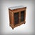This Napoleon III display cabinet is distinguished by its elegant cherrywood structure, the warmth of its natural grain...