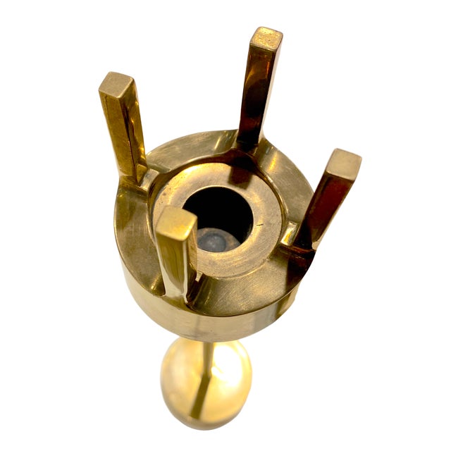 A stunning pair of Mid-Century Modern brass candlestick holders designed by renowned Swedish designer Pierre Forssell for...