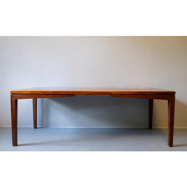 Rosewood coffee table with blue ceramic tiles set into the wood, Denmark 1960s.