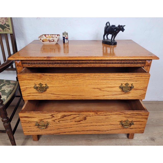 This is a gorgeous vintage Oak chest of drawers that is sure to exude a wonderful country charm to the home setting. Circa...