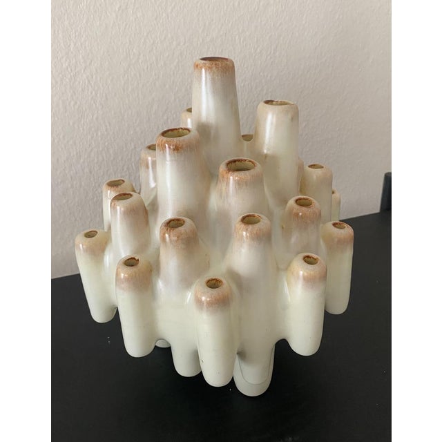 Step back in time to the artistic atmosphere of the 1960s with this remarkable sculptural pique fleurs vase, handcrafted...