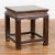 A late Qing Dynasty period side table from the early 20th century with waisted top, carved apron, horse hoof legs, and...