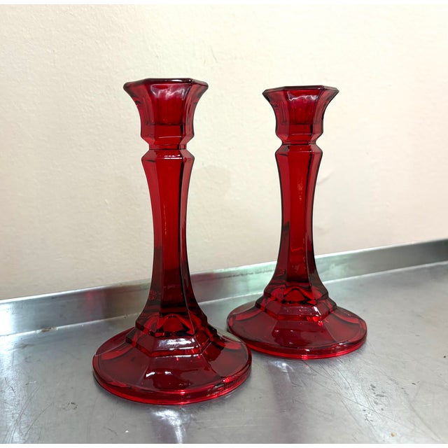 1940s-50s Ruby Red glass candle holders pair. Some minor signs of use around the tops of each as shown. Otherwise...