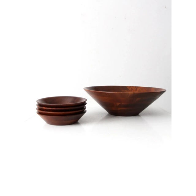 This is a mid 20th century vintage Vermillion walnut serving bowl set. The set includes a large bowl and four individual...