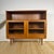 This elegant bookcase produced by Dyrlund in the 1960s represents a refined expression of Midcentury Modern Scandinavian...