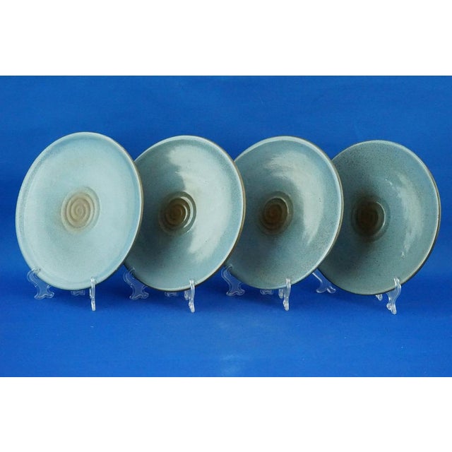 Item description: A very special set of four majolica ceramic plates, glazed in a futuristic style, entirely hand-modeled,...