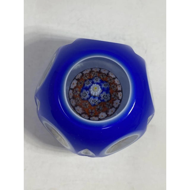 Incredible example of Millefiore paperweight encased within faceted glass, made in Murano, Italy. Highly collectible and...