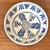 Folk Art painted earthenware bowl, circa mid 20th century. Perfect for holding oranges or displaying on a shelf. Numbered...