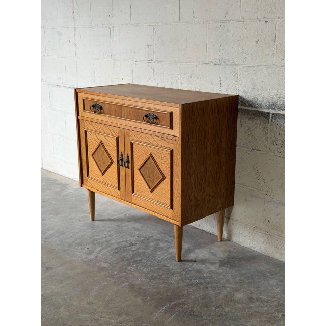 This versatile storage cabinet combines crisp geometric detailing with warm Scandinavian craftsmanship. Built in Sweden,...