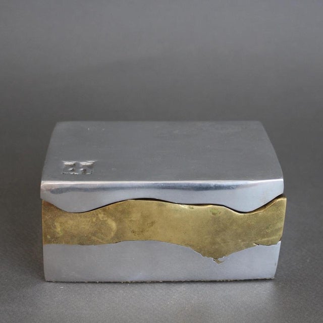 Brutalist aluminium and brass lidded box by David Marshall (circa 1980s). This brutalist style box is both weighty and...