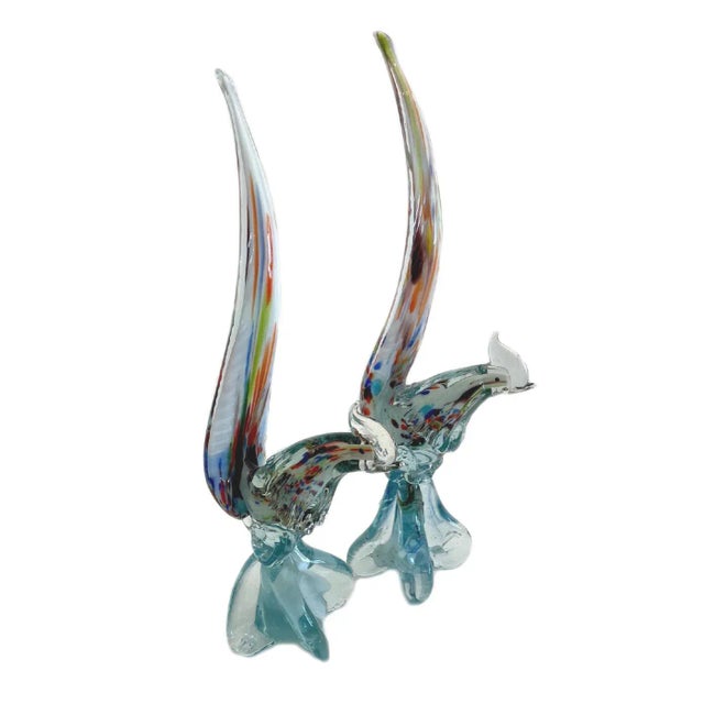 These are two matching hand blown Murano Glass Pheasants. They are basically the same size one is on a higher base. They...