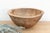 There is something deeply grounding about holding a vessel that was hewn by hand from a single block of wood. This antique...