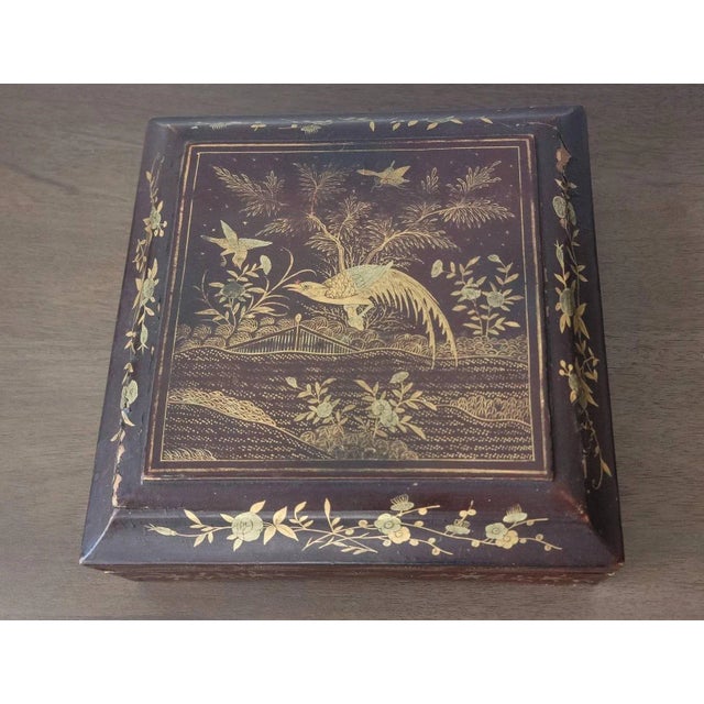 An antique Qing Dynasty Chinese sweetmeat (confectionery or sweet food) box, dating to the early 20th century, featuring a...