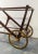 This serving bar cart is attributed to Cesare Lacca for form and style. No label or mark. This piece is attributed to the...