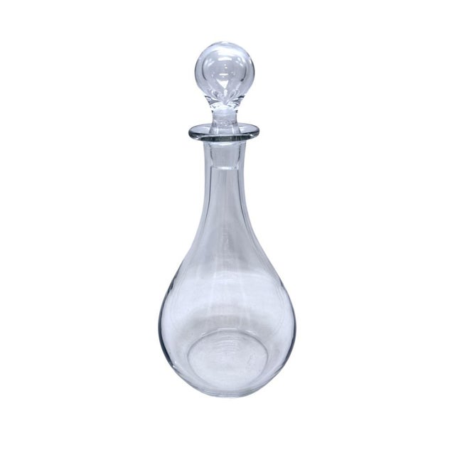 This crystal decanter by Val St Lambert offers timeless elegance, ideal for serving beverages or as a decorative piece. •...
