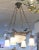 Circa 1920s hanging chandelier frosted glass drops with rose decoration large white glass shade in center. fixture is made...