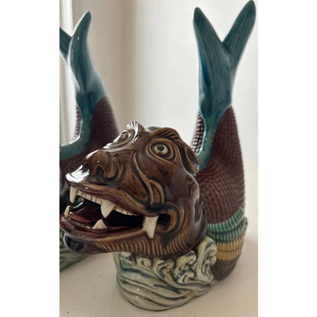 These vintage pair of Chinese porcelain statues of Koi Dragon Carp Dragon Fish figurines. They stand at 10" and 9.5" tall,...