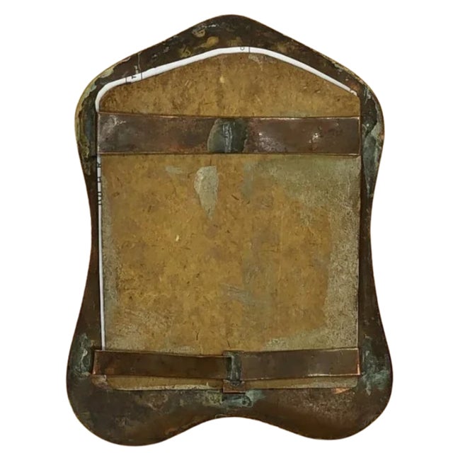 A beautiful example of Art Nouveau metalwork, this antique hand-hammered copper picture frame embodies the movement's...