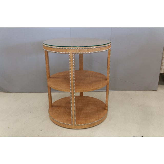 An elegant tiered table from the Century Furniture Curate Collection. Crafted of Gmelina Solids with Raffia. Two open...