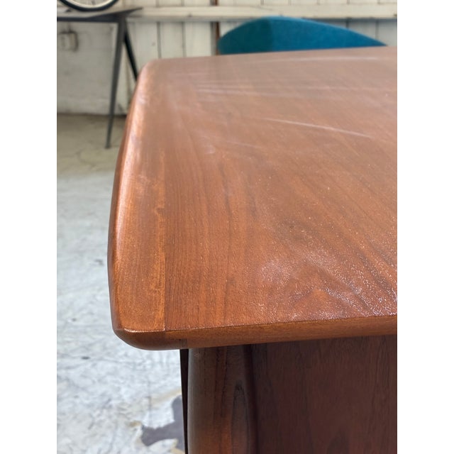 Vintage Danish modern walnut writing desk, featuring tapered legs, one filing drawer and two smaller drawers that all move...