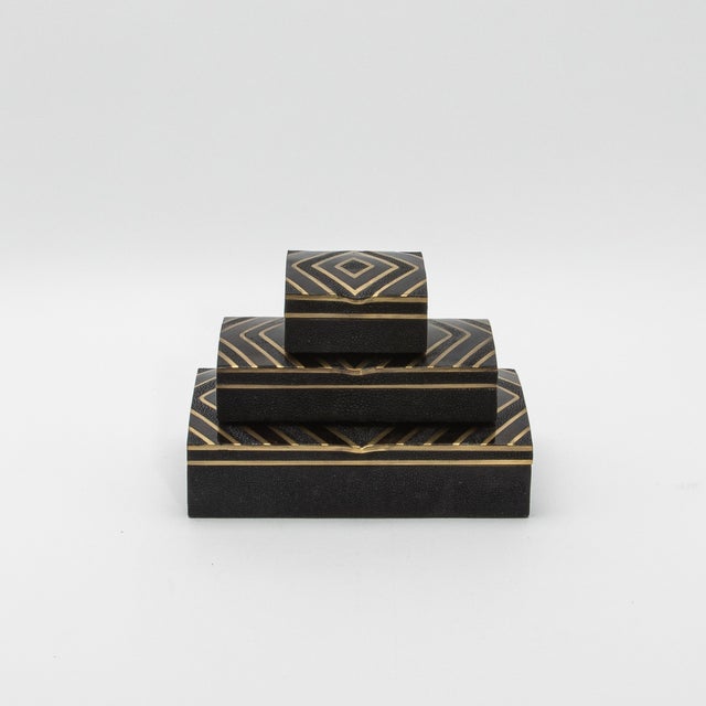 The set of 3 boxes by R&Y Augousti in black oak with black shell, shagreen and brass details embodies timeless...
