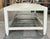 This elegant shagreen coffee table features a clean, rectangular silhouette with a sophisticated off-white finish. The...