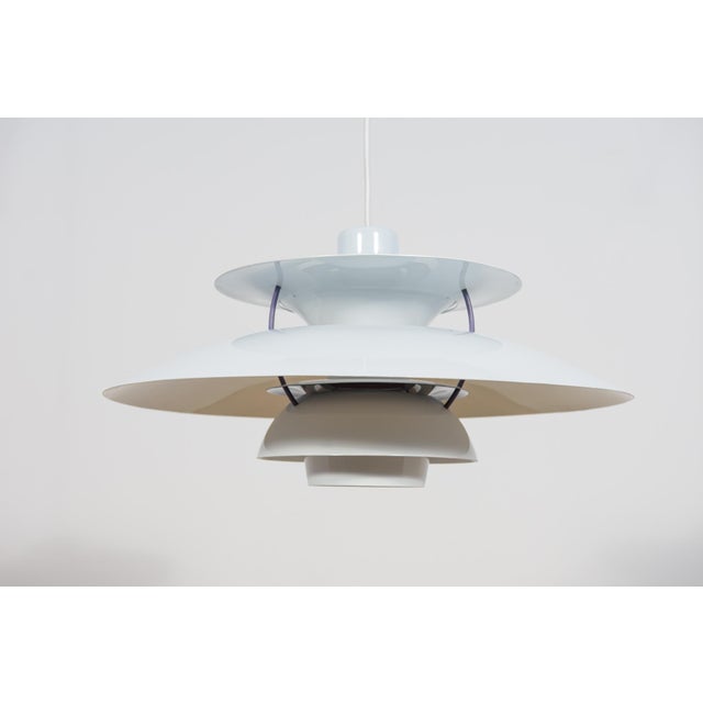This is a Poul Henningsen's 1958 design based on the principle of a reflective three-shade system, which directs the...