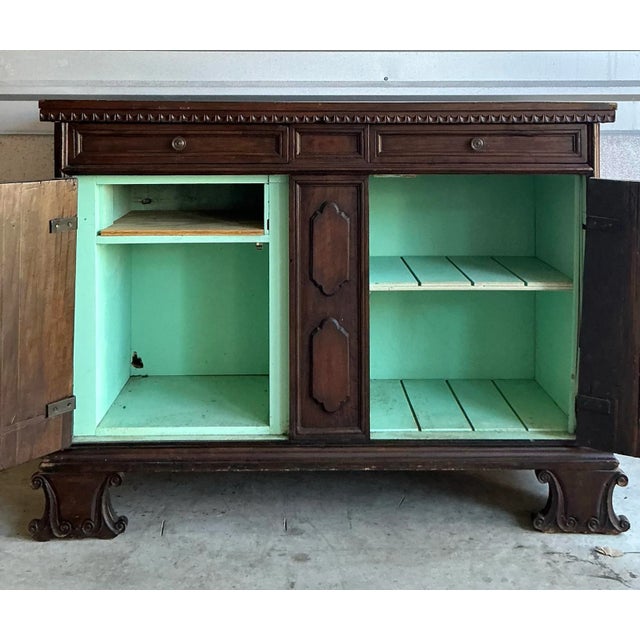 Presenting a magnificent Vintage Tuscan Walnut Carved Buffet, a substantial piece that evokes the grandeur and rustic...