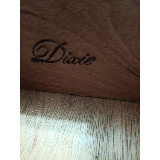 The Dixie Wood Dresser is a French Provincial 10 drawer dresser made of solid wood with intricate carvings, adding a touch...