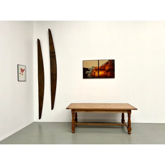 Maison Lecan presents this 1970s table with an oak and oak veneer top, resting on a turned cherry wood base, connected by...