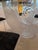 Made by Sharooz Nia in the 1990s. Glass and Lucite with swan bases. 8 acrylic chairs with black fabric seats