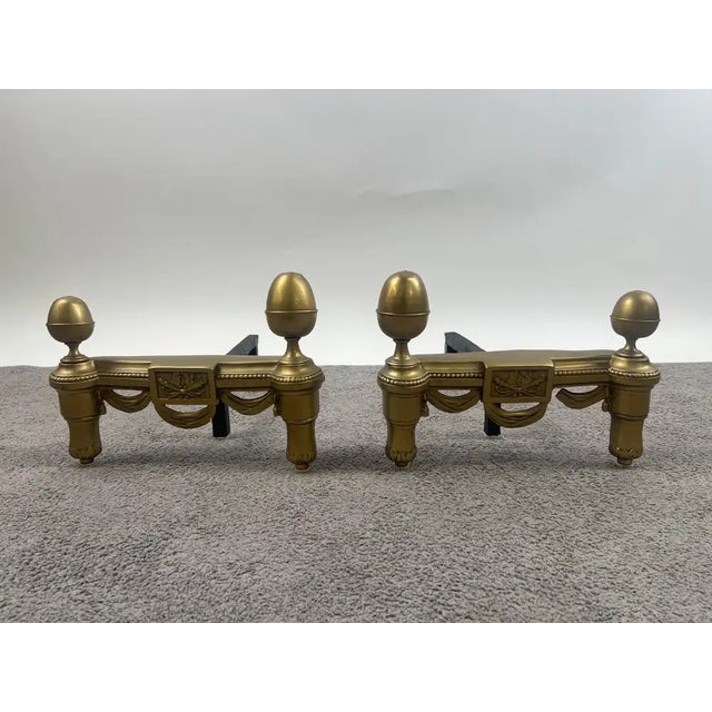Antique French Brass Andirons with Acorn Finials & Swag Detail, a Pair This elegant pair of antique andirons showcases...