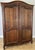 A handsome Antique French Louis wardrobe crafted in oak, featuring a rich warm finish, beautifully shaped panelled doors,...