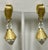 This is part of Chairish’s Costume Jewelry assortment. Bright gold clip on earrings with Aurora borealis crystal drop...