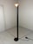 Floor lamp by Arelux Milano, Italy (marked). Minimalist design. Black stand with a small white glass lampshade. Halogen,...