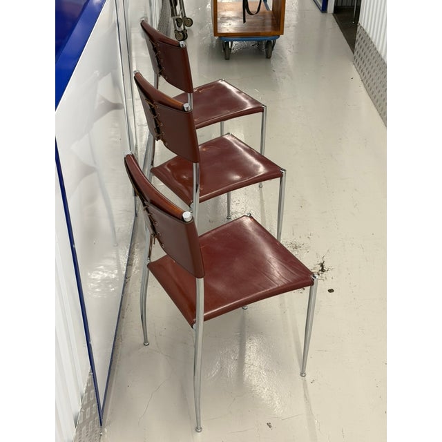 This set of three "Ginger" dining chairs was produced by Fasem, the Italian manufacturer known since the late 1970s for...