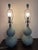 There is a three way lights on these ribbed French blue stacked ball lamps that radiate a beautiful golden light for any...