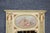 This highly decorative Louis XVI-style trumeau mirror presents an elegant combination of painted decoration, parcel-gilt...