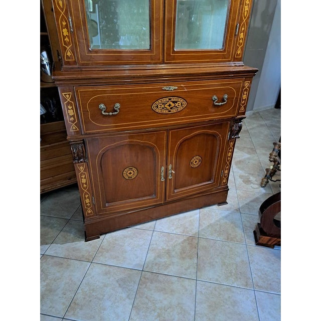 English inlaid mahogany bookcase with writing desk – late 19th century. This elegant English mahogany bookcase dating back...
