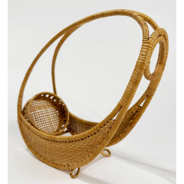 Function and style! We love this vintage woven wicker wine caddy bottle holder with wrapped handle for its chic presence...