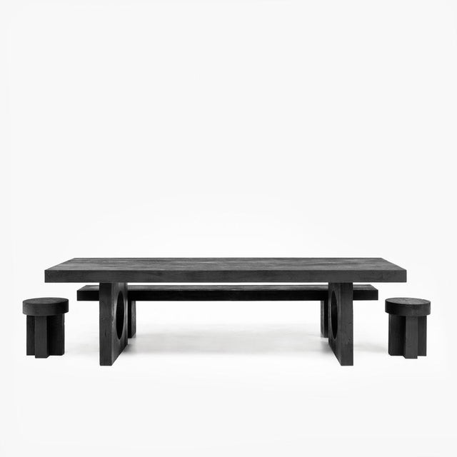 The Kurai Collection consists of a solid Padouk table, bench, and stools finished with the Shou Sugi Ban technique....