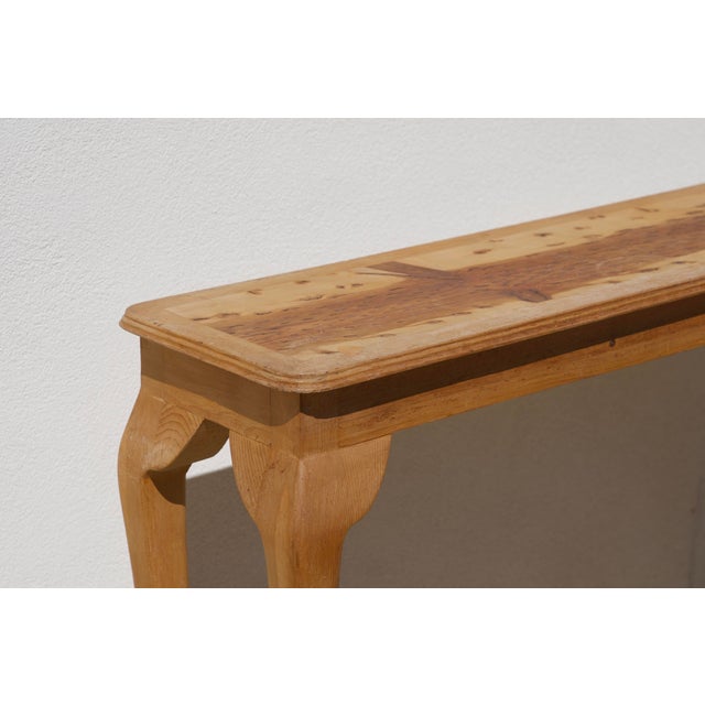 Every so often a piece of wood tells its own story, and this table's top does exactly that. Years ago, a forest fire swept...