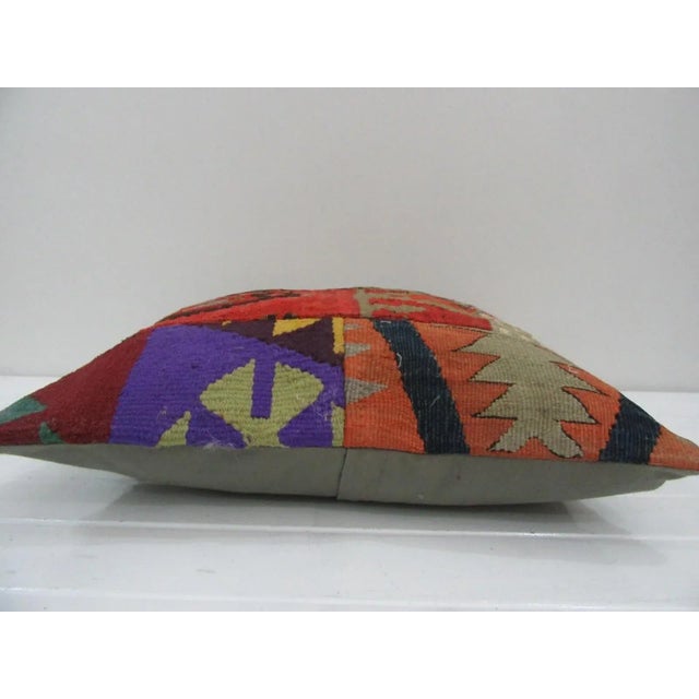 This is a pillow cover made from a vintage kilim rug. The piece was properly washed and ready to use. Pillow inserts not...