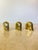 Set of three vintage solid brass elephant paperweights, known as "Drumbo," produced as an exclusive gift by Dresdner Bank...