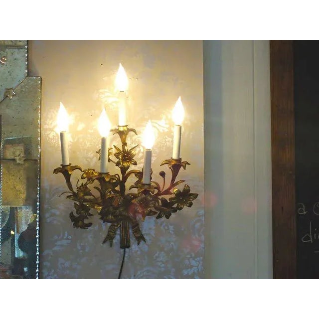 Lovely and fairly large, floral motiffe with bows at the bottom. 5 bulbs up to 60 watt each.