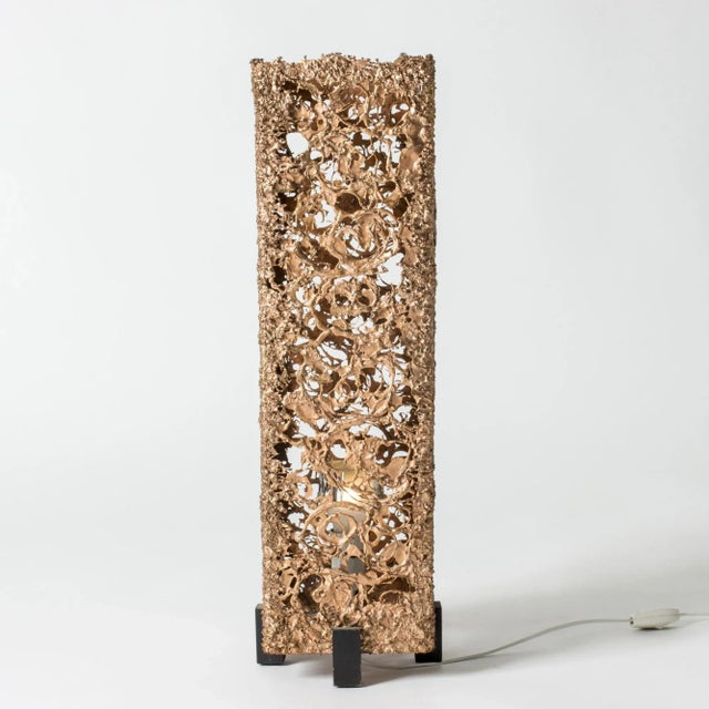 Very cool copper floor lamp, made in Sweden in the 1960s in a brutalist design. The sleek shape body of the lamp is made...