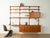 A classic shelving system from the 1960s. The high-quality containers and shelves are veneered in teak. The system...