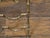 A French brass faux bamboo wine rack from the mid 20th century with arching side supports and pad feet. This charming...