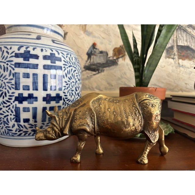 Sculptural solid brass rhino figure with detailed texture of animal hide. Heavy and solid piece. I ship quickly and...
