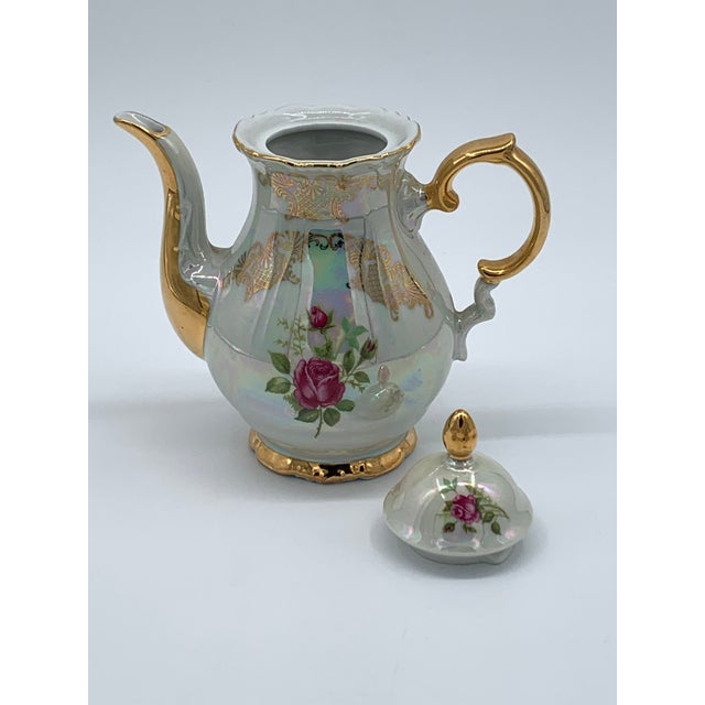 This Bavarian Opalescent Tea Set by Gareis, Kuhnl & Co is perfect for adding a touch of vintage elegance to your home....